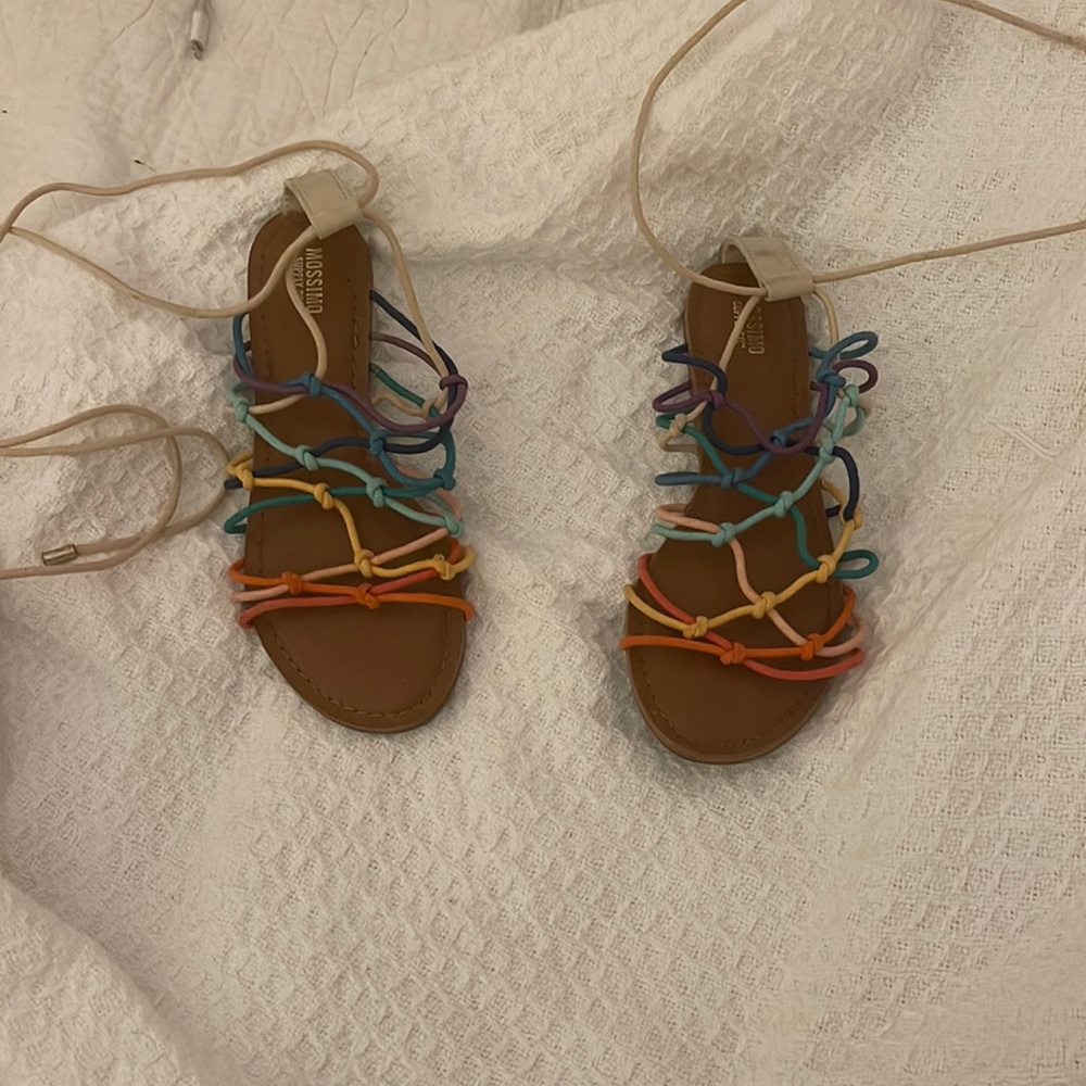 Rainbow Sandals W/ nude strings to tie around ankle. Never worn. Size 6.5